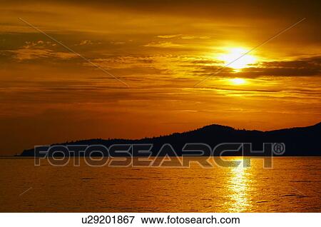 Orange sunset over water View Large Photo Image Stock Photo - Orange sunset over water. Fotosearch