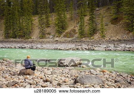 Person enjoying a river View Large Photo Image Stock Photography - Person enjoying a river. Fotosearch