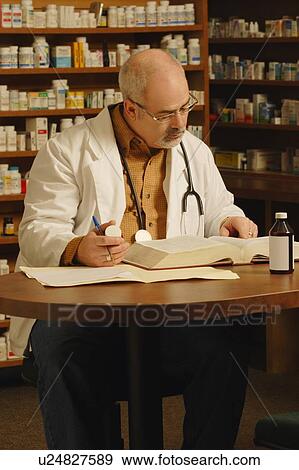 Stock Photo - Pharmacist at work. Fotosearch