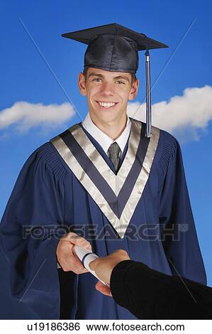 Stock Photograph - Portrait of a graduate receiving a scroll. Fotosearch
