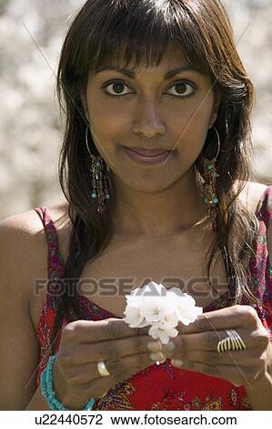 Stock Image - Portrait of a woman with blossom. Fotosearch