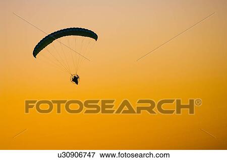 Powered parachute or paraglider View Large Photo Image Stock Photo - Powered parachute or paraglider. Fotosearch