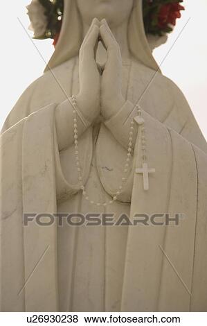 Praying hands of a statue View Large Photo Image Stock Photo - Praying hands of a statue. Fotosearch