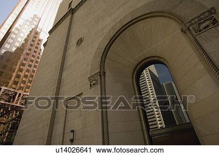 Stock Image - Reflection of downtown buildings in window. Fotosearch