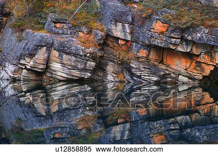 Reflection of rock in water View Large Photo Image Stock Photography - Reflection of rock in water. Fotosearch