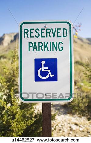 Reserved parking sign for handicapped View Large Photo Image Stock Photo - Reserved parking sign for handicapped. Fotosearch