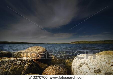 Rocks at edge of lake View Large Photo Image Stock Image - Rocks at edge of lake. Fotosearch
