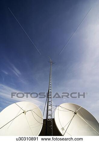 Satellite dishes and tower View Large Photo Image Stock Image - Satellite dishes and tower. Fotosearch