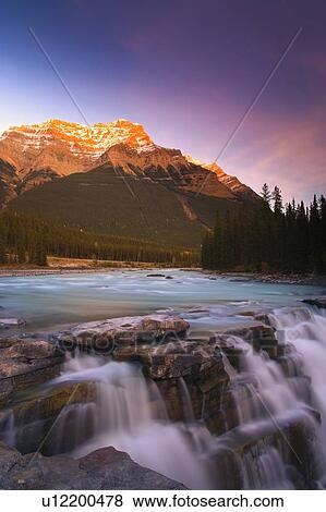 Stock Photo - Scenic mountain waterfall. Fotosearch