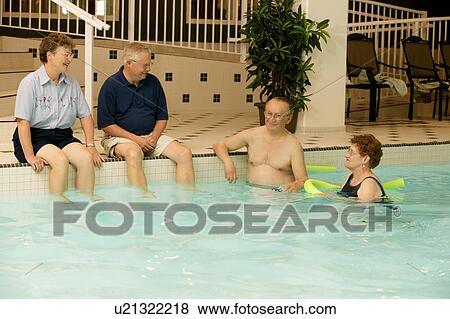 Stock Photo - Seniors in a swimming pool. Fotosearch