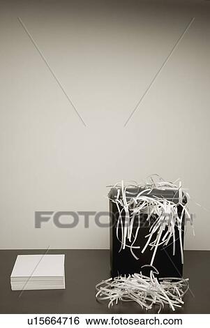 Shredded and non-shredded paper View Large Photo Image Stock Photograph - Shredded and non-shredded paper. Fotosearch