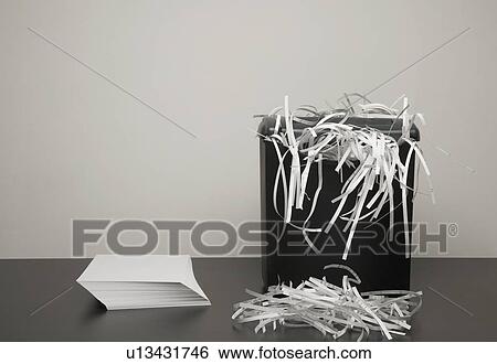 Shredded paper in a garbage can View Large Photo Image Stock Photograph - Shredded paper in a garbage can. Fotosearch