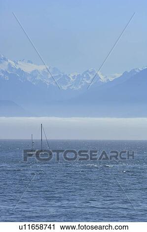 Single boat with mountain backdrop View Large Photo Image Stock Image - Single boat with mountain backdrop. Fotosearch