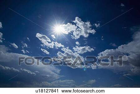 Sun shining through the clouds View Large Photo Image Stock Image - Sun shining through the clouds. Fotosearch
