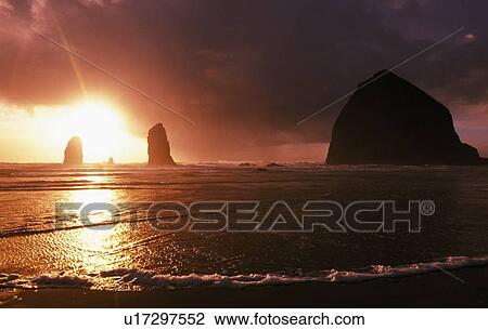 Sunset on haystack rock at Cannon Beach View Large Photo Image Stock Image - Sunset on haystack rock at Cannon Beach. Fotosearch