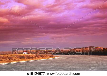 Stock Photo - Sunset over a river. Fotosearch