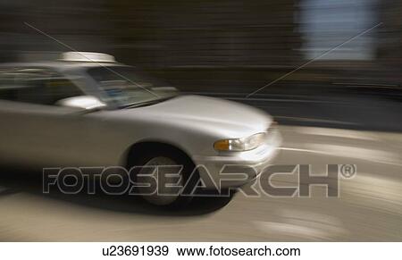 Taxi cab in motion View Large Photo Image Stock Photo - Taxi cab in motion. Fotosearch