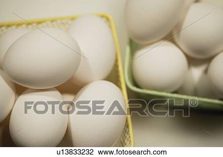 Stock Image - Two baskets of eggs. Fotosearch