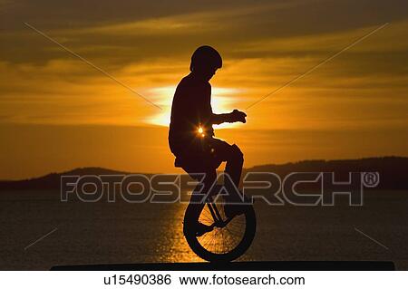 Unicycling View Large Photo Image Stock Photograph - Unicycling. Fotosearch