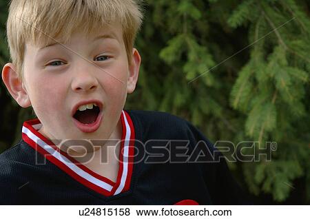 Stock Photo - Very surprised boy. Fotosearch