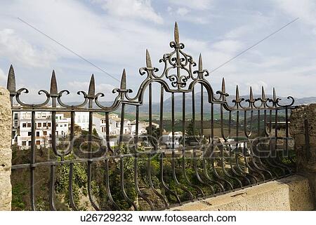 View of villas through iron railing View Large Photo Image Stock Image - View of villas through iron railing. Fotosearch
