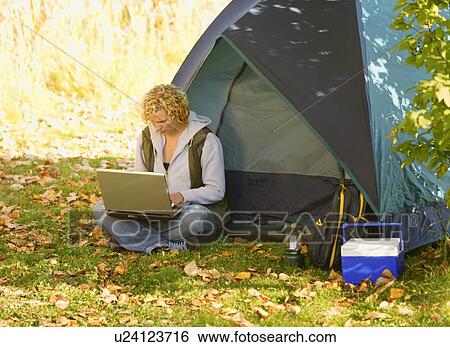 Stock Photograph - Woman camping. Fotosearch