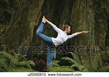 Woman doing yoga View Large Photo Image Stock Photography - Woman doing yoga. Fotosearch