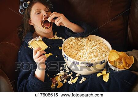 Woman eating junk food View Large Photo Image Stock Photography - Woman eating junk food. Fotosearch