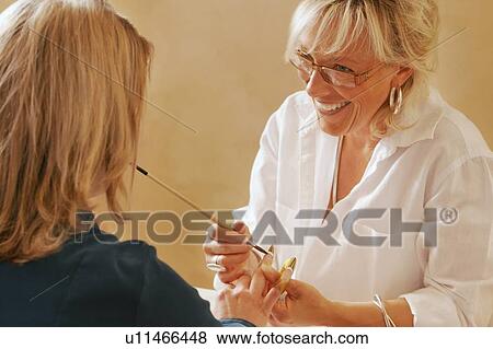 Woman having nails done View Large Photo Image Stock Photo - Woman having nails done. Fotosearch