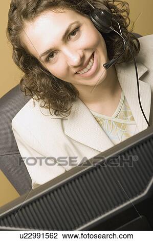 Woman wearing headphones View Large Photo Image Stock Image - Woman wearing headphones. Fotosearch