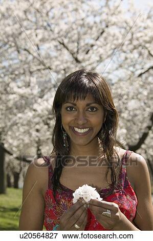 Woman with cherry tree blossoms View Large Photo Image Stock Photo - Woman with cherry tree blossoms. Fotosearch