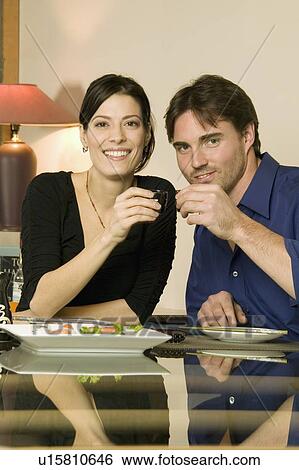 Stock Photograph - Young couple toasting. Fotosearch