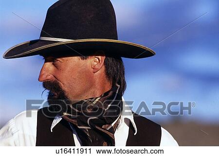 Close-up profile portrait of cowboy View Large Photo Image Stock Image - Close-up profile portrait of cowboy. Fotosearch