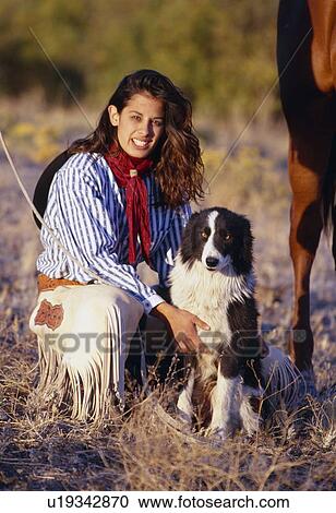 Cowgirl with her dog View Large Photo Image Stock Image - Cowgirl with her dog. Fotosearch