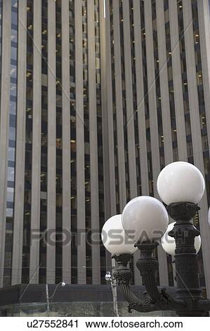 Stock Image - Downtown building and lamp post. Fotosearch
