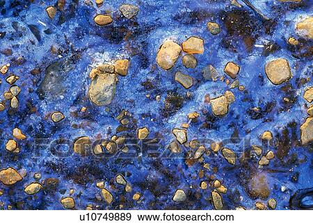 Frozen oil in ice View Large Photo Image Stock Photo - Frozen oil in ice. Fotosearch