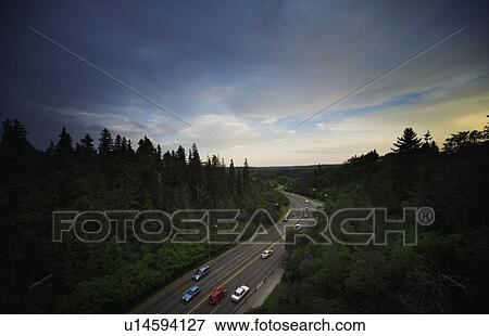 Stock Photo - High angle view of traffic moving on a rural highway. Fotosearch