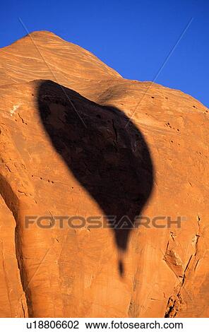 Hot air balloon shadow on rock cliff View Large Photo Image Stock Image - Hot air balloon shadow on rock cliff. Fotosearch