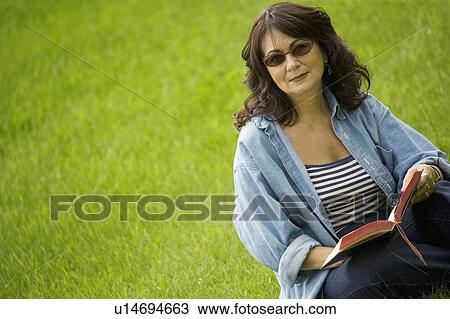 Lady reading in the park View Large Photo Image Stock Image - Lady reading in the park. Fotosearch