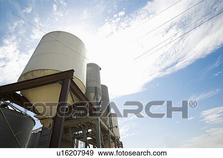Looking up at silage containers View Large Photo Image Stock Photo - Looking up at silage containers. Fotosearch