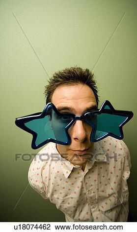 Stock Image - Man in Novelty Glasses. Fotosearch