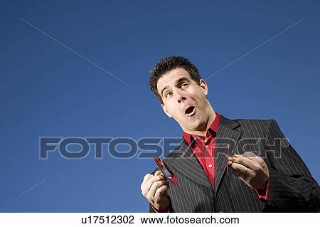 Stock Image - Man playing child size cymbals. Fotosearch