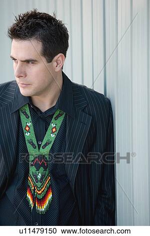 Stock Image - Man with aboriginal apparel. Fotosearch