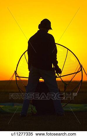 Stock Photography - Man with Parachute. Fotosearch