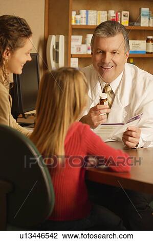 Pharmacist giving prescription to child View Large Photo Image Stock Image - Pharmacist giving prescription to child. Fotosearch