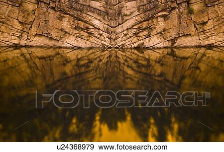 Rock Face Reflected in Water View Large Photo Image Stock Photo - Rock Face Reflected in Water. Fotosearch