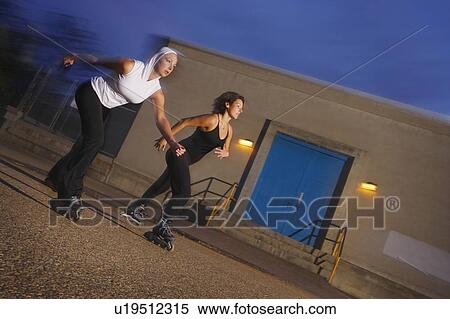 Rollerblading at night View Large Photo Image Stock Photography - Rollerblading at night. Fotosearch