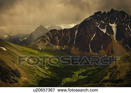 Stock Photo - Storm Clouds in Valley. Fotosearch