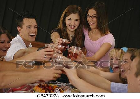 Stock Photo - Teenagers toast. Fotosearch