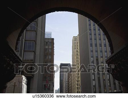 Stock Photograph - Urban scene under archway. Fotosearch